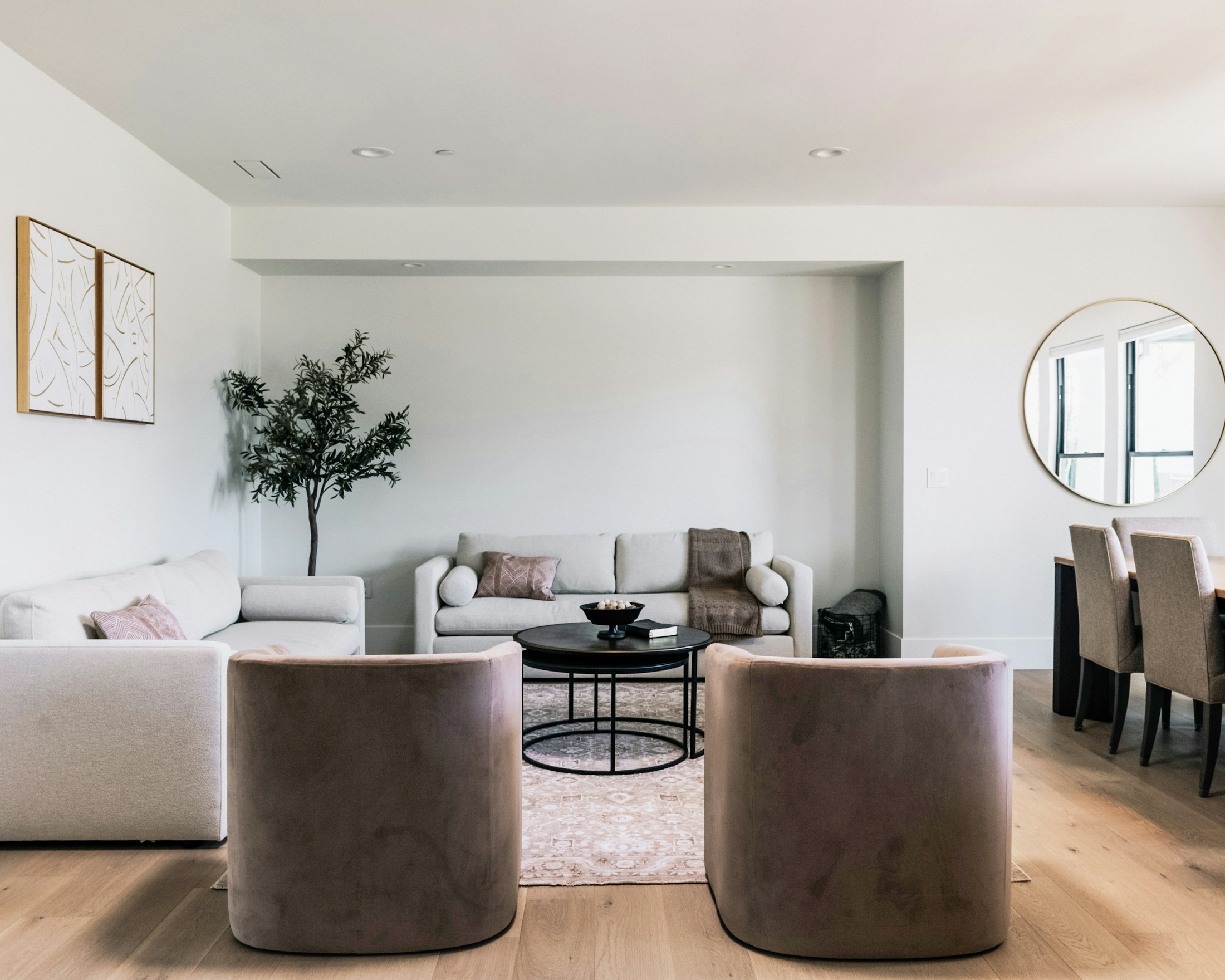 Editorial reference: a light-filled living room in a blush and neutral palette