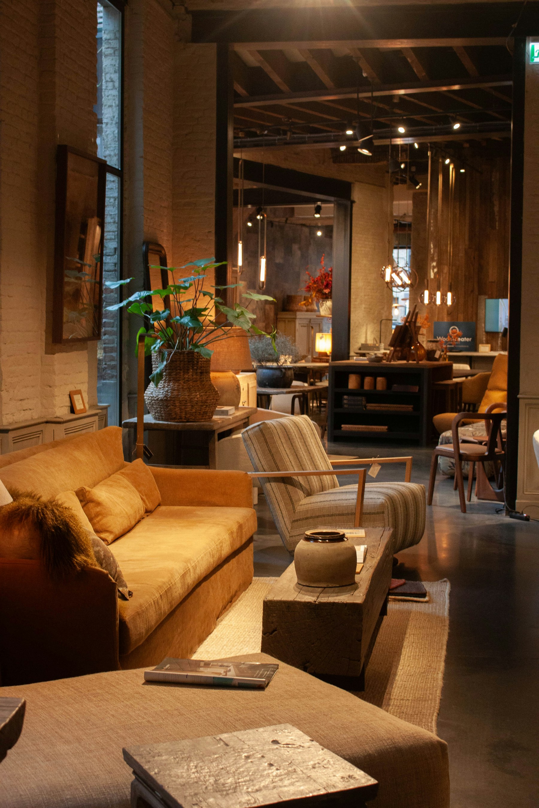Warm layered furniture showroom with amber upholstery and natural textures